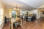 Open floor plan living, dining, and kitchen area